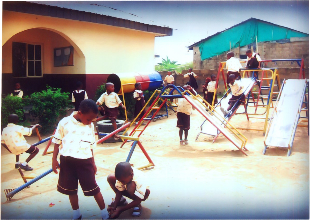 Kindergarten pupils enjoying supervised outdoor play on the school playground